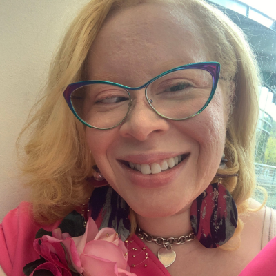 Photo of Ernee, founder of Faith In The Word blog, sharing faith and culture insights.